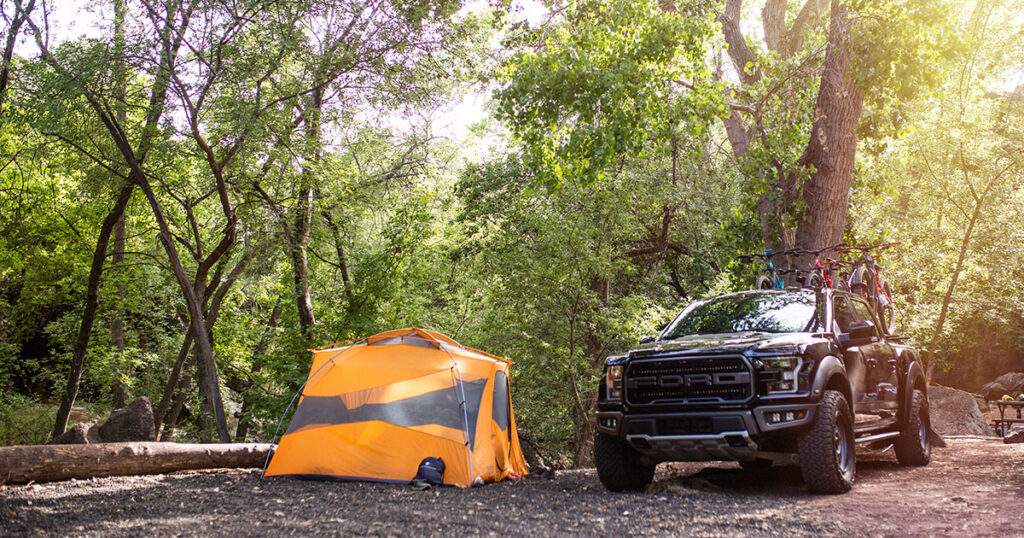 A truck and tent on a premium view campsite.